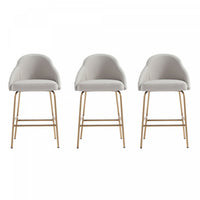 Tabouret de comptoir moderne en metal Gracie avec revetement en tissu, gris pierre et or - Lot de 3