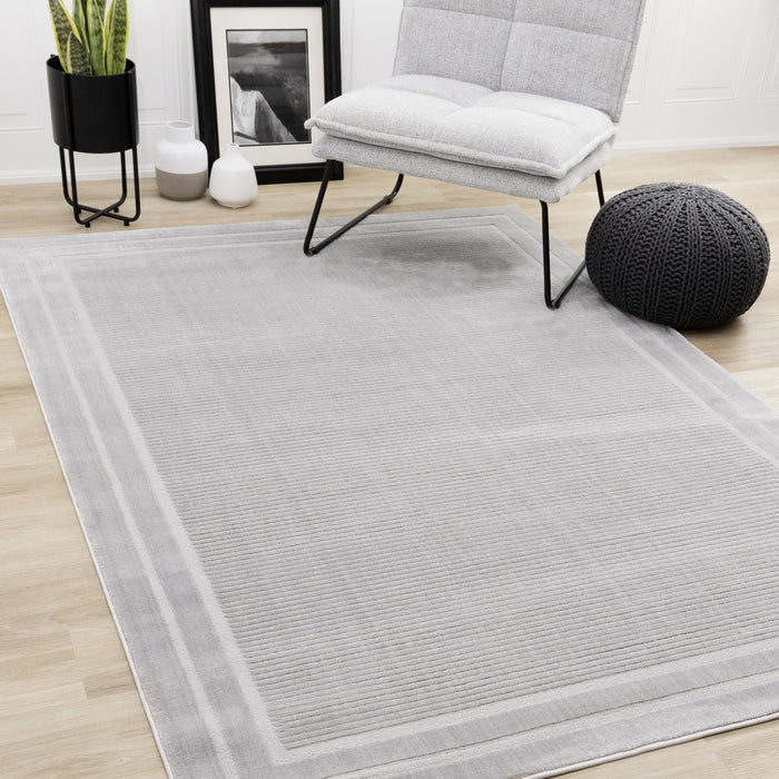 Carpette à poil long et court Ellie en polyester doux texturé à bordure grise - 5 pi 3 po x 7 pi 7 po