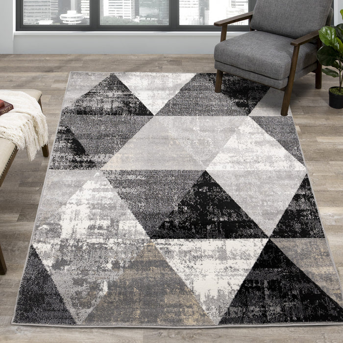 Carpette Covington à motifs de triangles vieillis - 6 pi 7 po x 9 pi 10 po