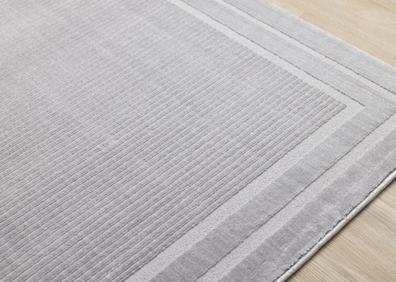 Carpette à poil long et court Ellie en polyester doux texturé à bordure grise - 5 pi 3 po x 7 pi 7 po