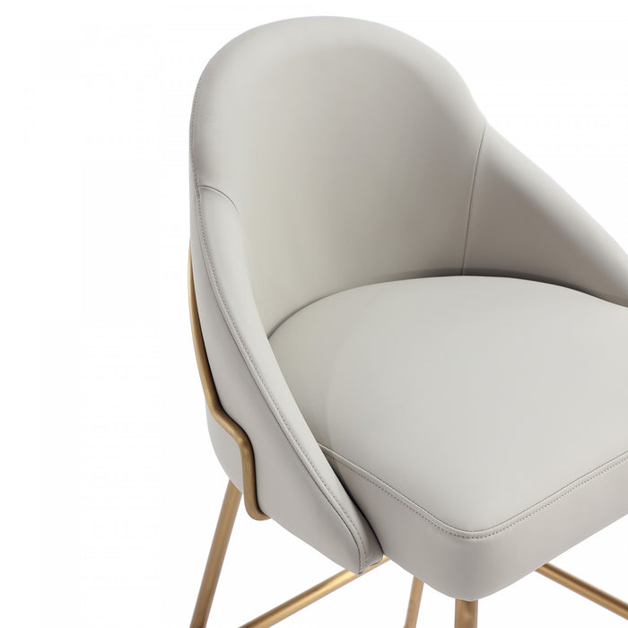 Tabouret de comptoir moderne en metal Gracie avec revetement en tissu, gris pierre et or - Lot de 2