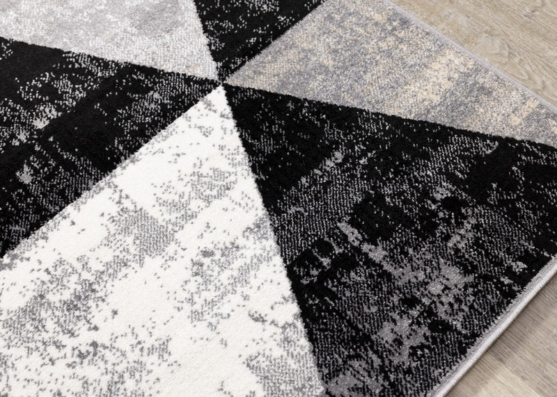 Carpette Covington à motifs de triangles vieillis - 6 pi 7 po x 9 pi 10 po