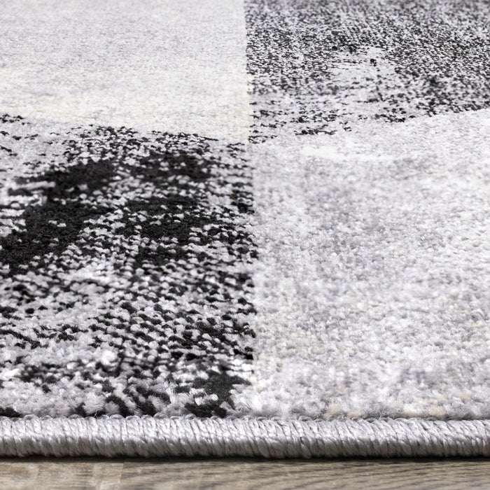 Carpette Covington à motifs de triangles vieillis - 6 pi 7 po x 9 pi 10 po