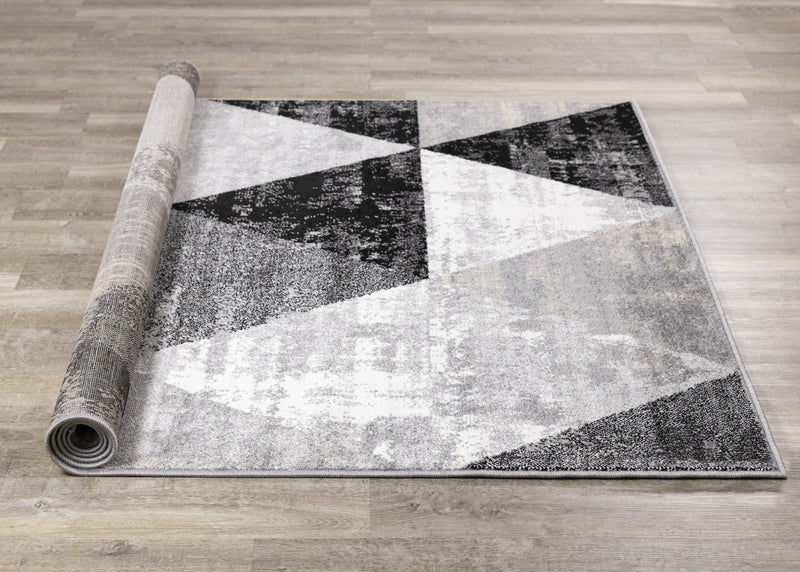 Carpette Covington à motifs de triangles vieillis - 6 pi 7 po x 9 pi 10 po