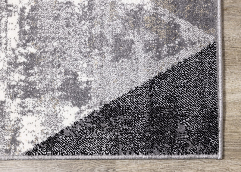 Carpette Covington à motifs de triangles vieillis - 6 pi 7 po x 9 pi 10 po