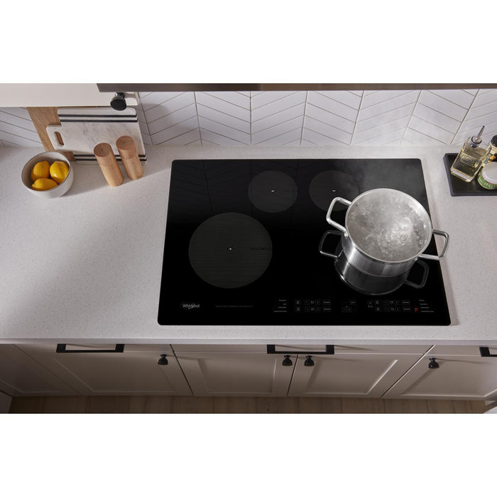 Surface de cuisson à induction Whirlpool de 31 po à 4 éléments - noire - WCI55US0JB
