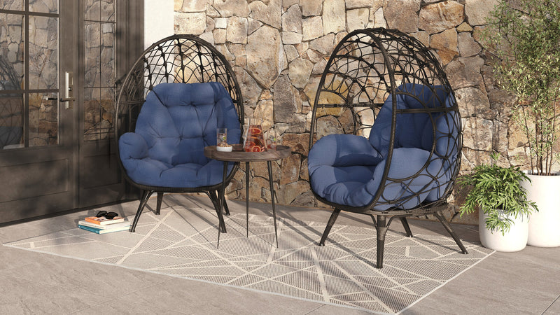 Fauteuil en forme d’œuf Coco de Kort & Co. pour la terrasse à l’extérieur - osier en résine tressé à la main, résistant aux rayons UV et aux intempéries - gris foncé et bleu