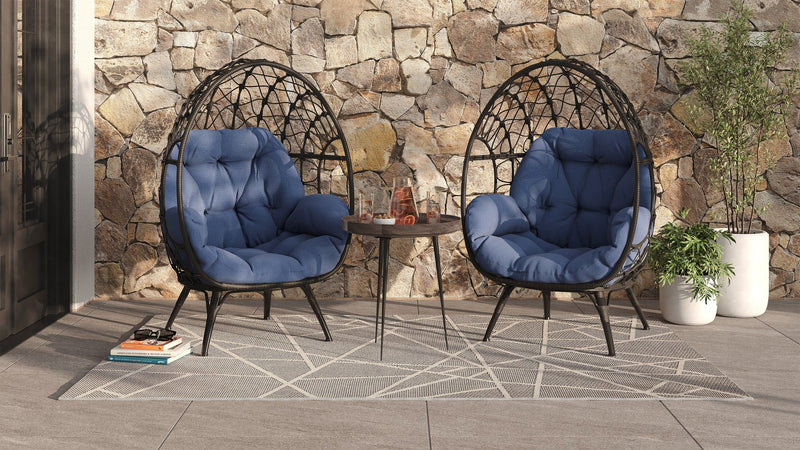 Fauteuil en forme d’œuf Coco de Kort & Co. pour la terrasse à l’extérieur - osier en résine tressé à la main, résistant aux rayons UV et aux intempéries - gris foncé et bleu
