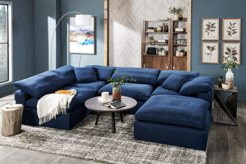 Sofa sectionnel modulaire Eclipse 6 pièces en tissu d’apparence lin avec poufs et coussins réversibles en duvet et plumes - bleu marine