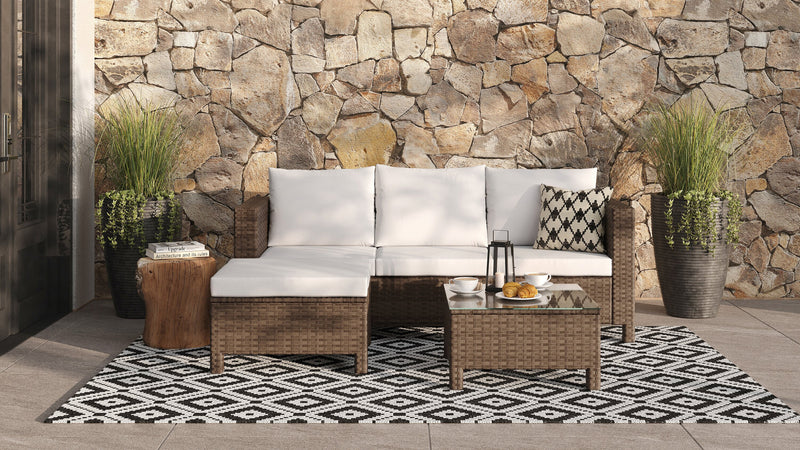 Ensemble de conversation Miami 3 pièces pour la terrasse à l’extérieur avec sofa, pouf et table à café à dessus en verre - osier en résine tressé à la main, résistant aux rayons UV et aux intempéries - brun et taupe