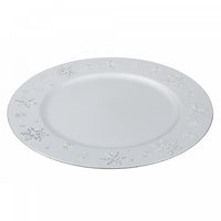 Assiette de présentation argentée ornée de flocons de neige
