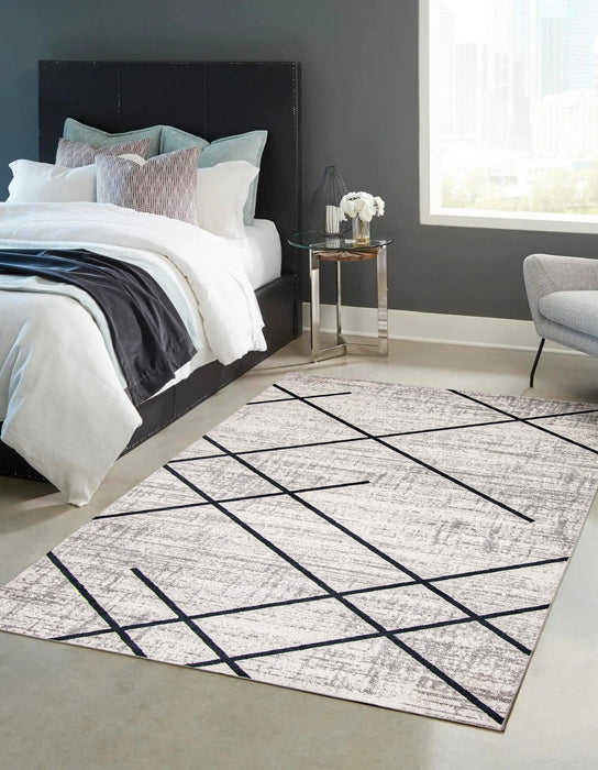 Carpette Damali ivoire et bleue lavable à la machine - 5 pi 0 po x 7 pi 0 po