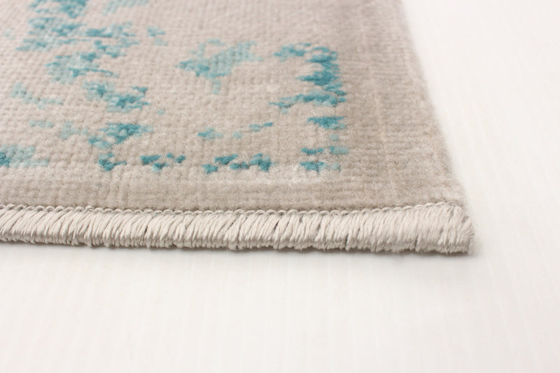 Carpette Corinne turquoise 5 pi 3 po x 7 pi 7 po