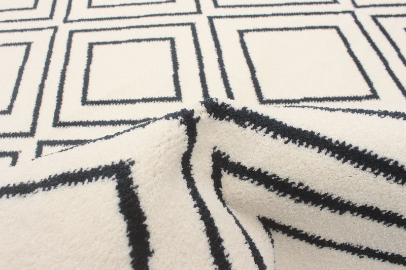 Carpette August blanc géodebleu marine 7 pi 10 po x 10 pi 2 po