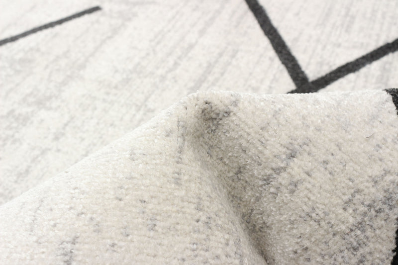 Carpette Damali ivoire et noire lavable à la machine - 6 pi 0 po x 9 pi 0 po